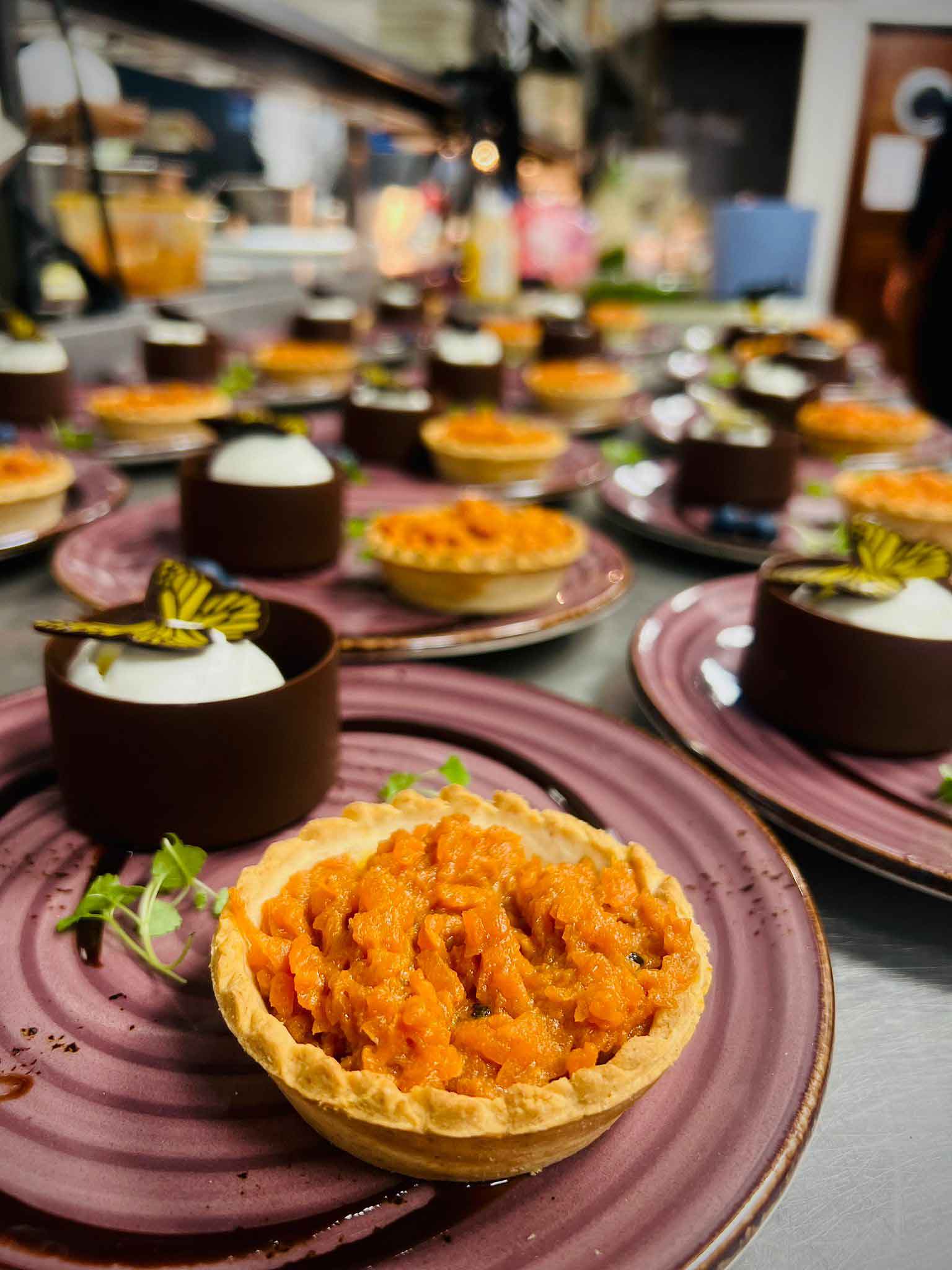 indian inspired desserts being made for an event