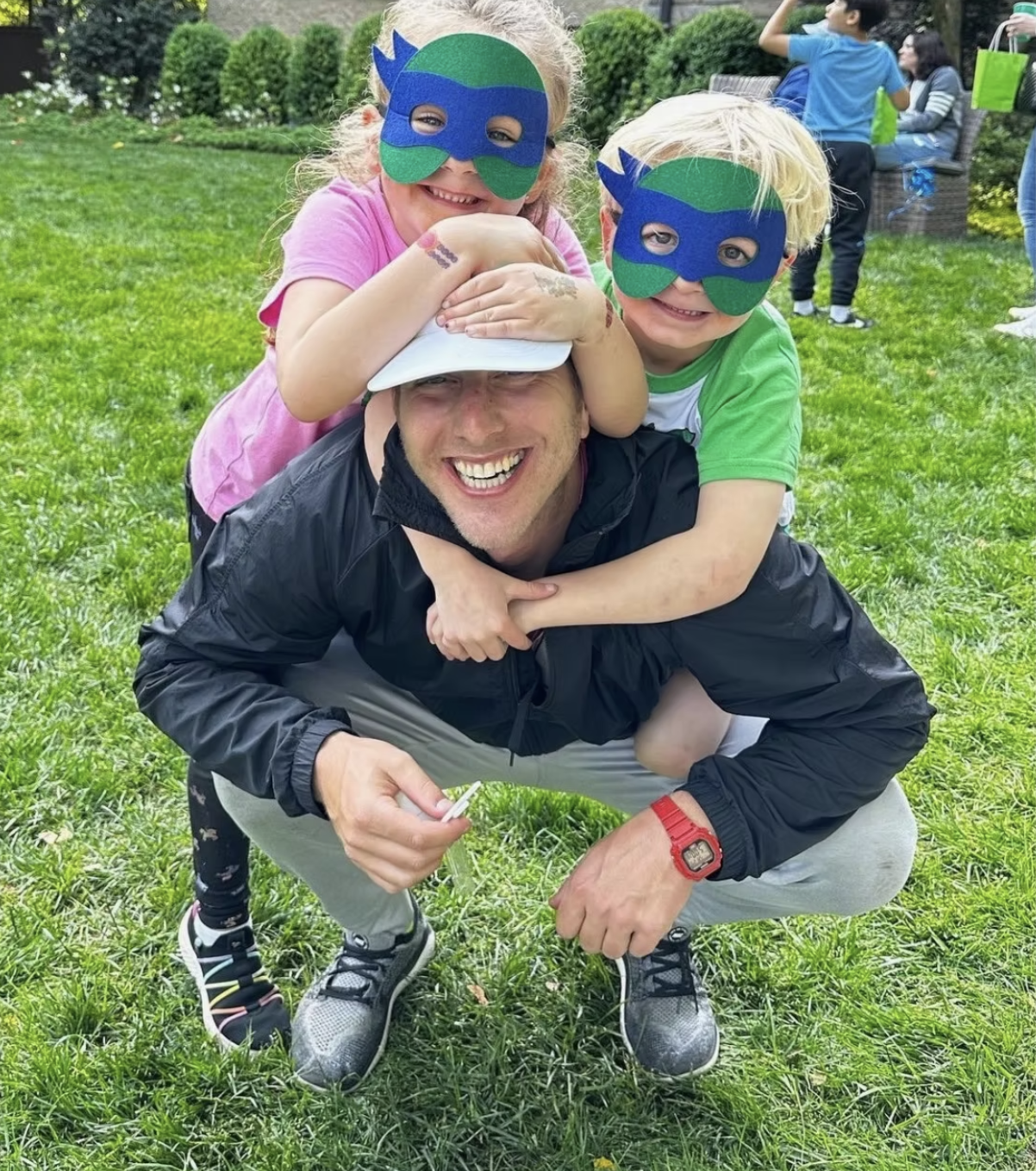 image of volunteer teaching children