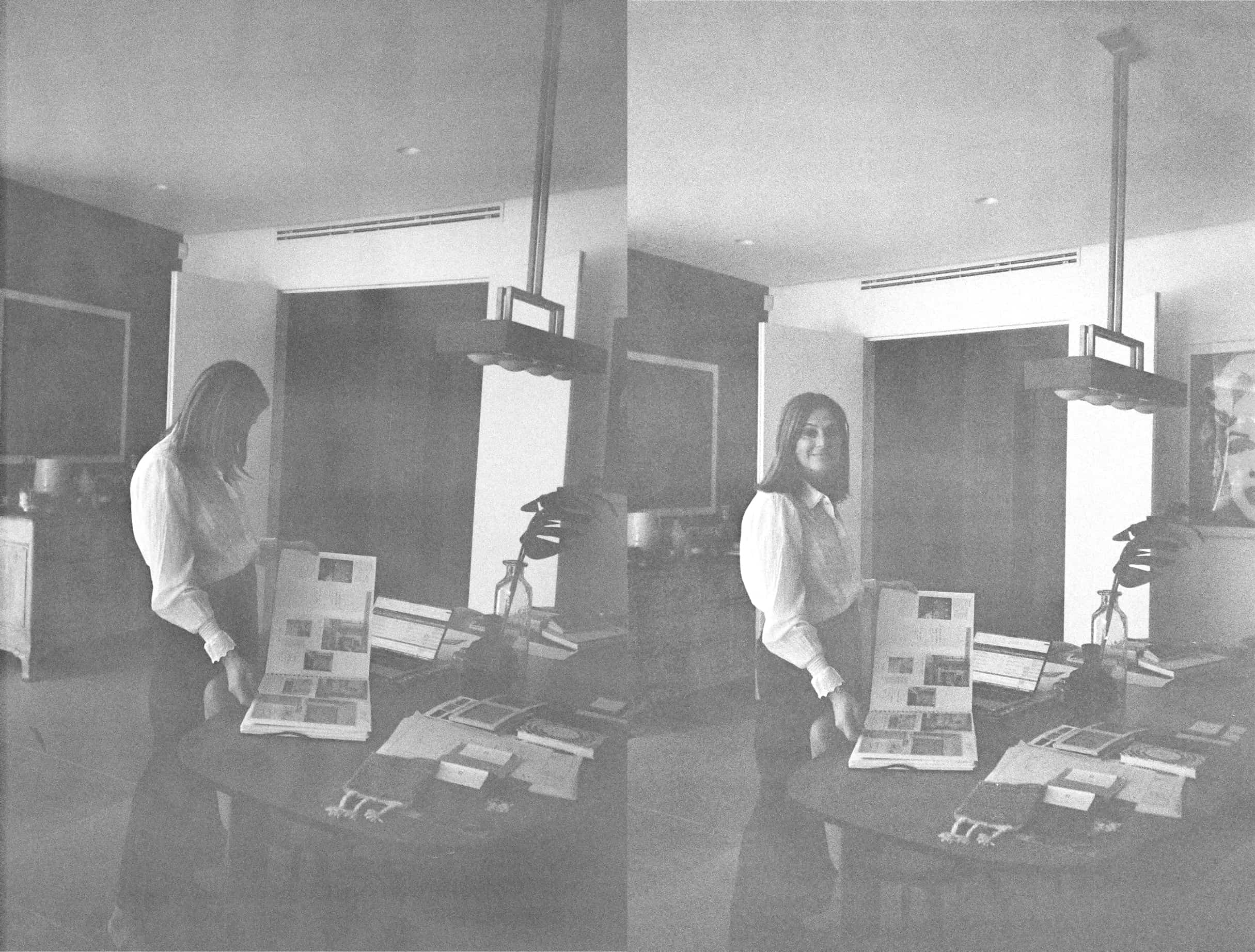 Suzi standing at a table with open magazine, facing down in left frame and smiling at camera in right frame.