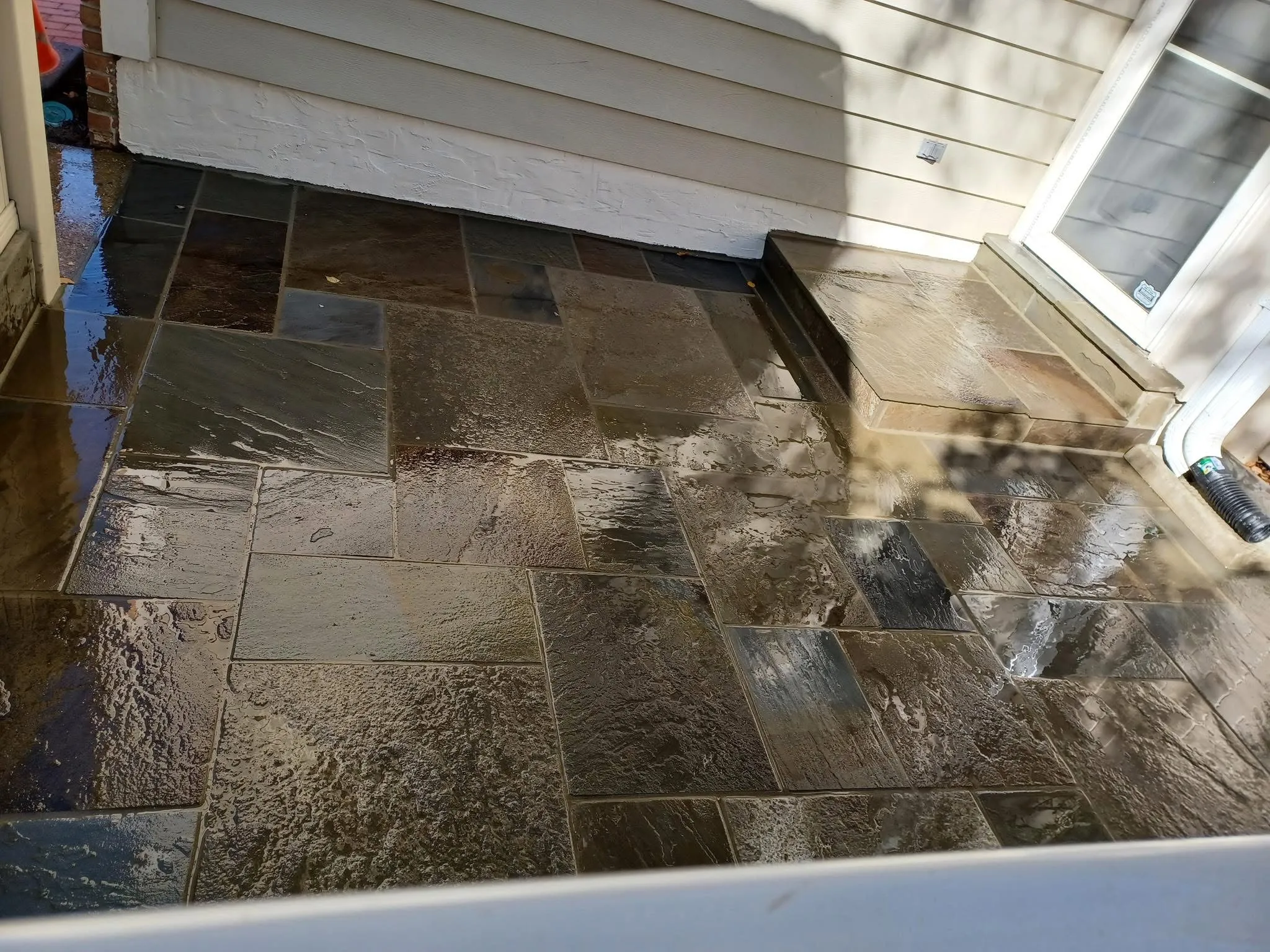 Finished flagstone patio and stone steps completed by CES Construction