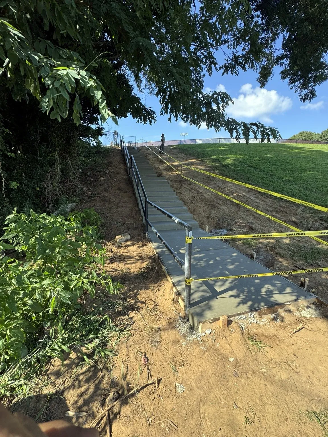 Finished concrete steps and connecting sidewalk completed by CES Construction