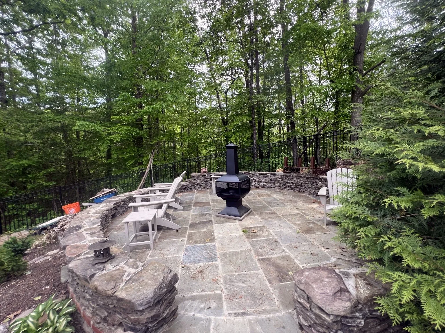 Finished flagstone patio and fire area built by CES Construction