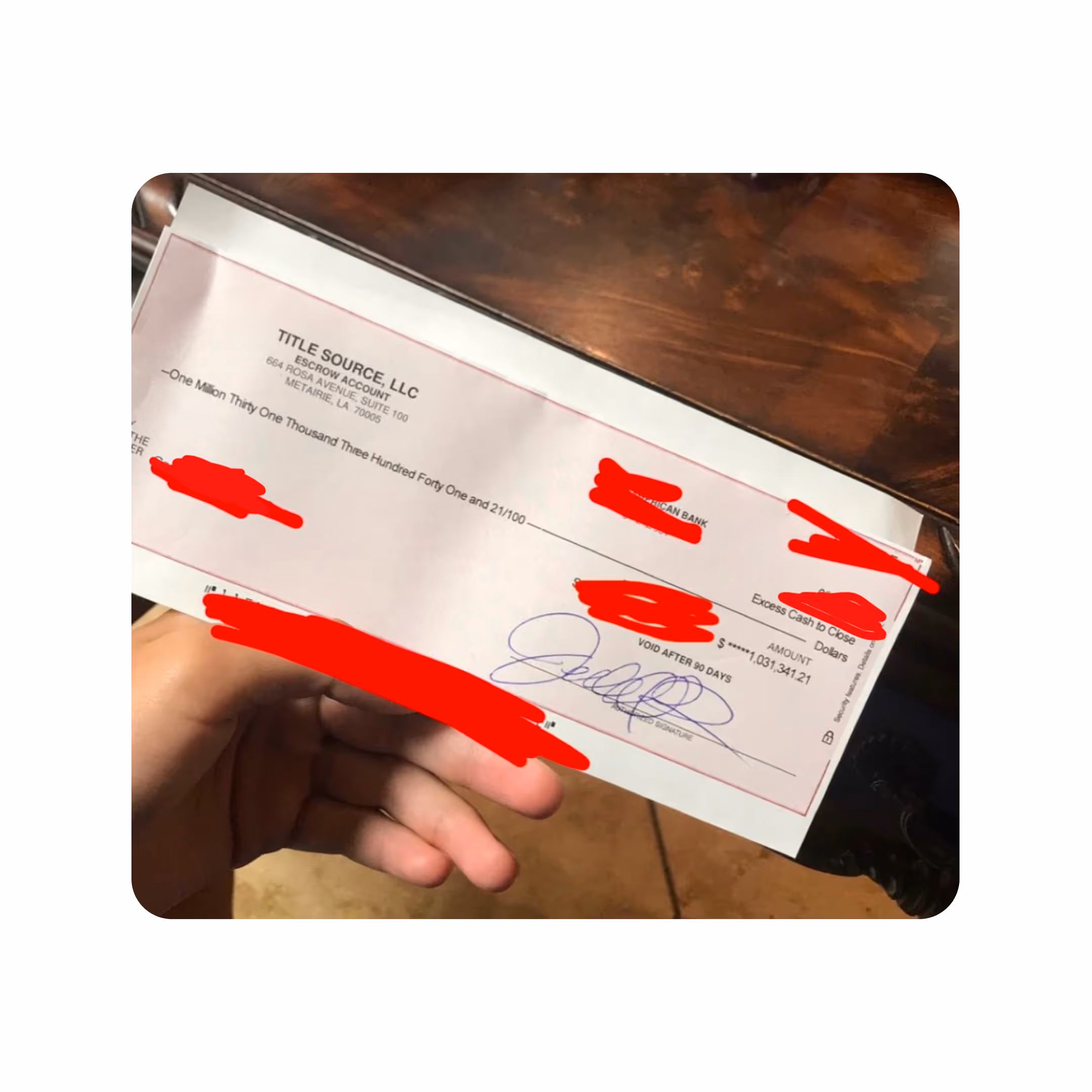 Hand holding a check
