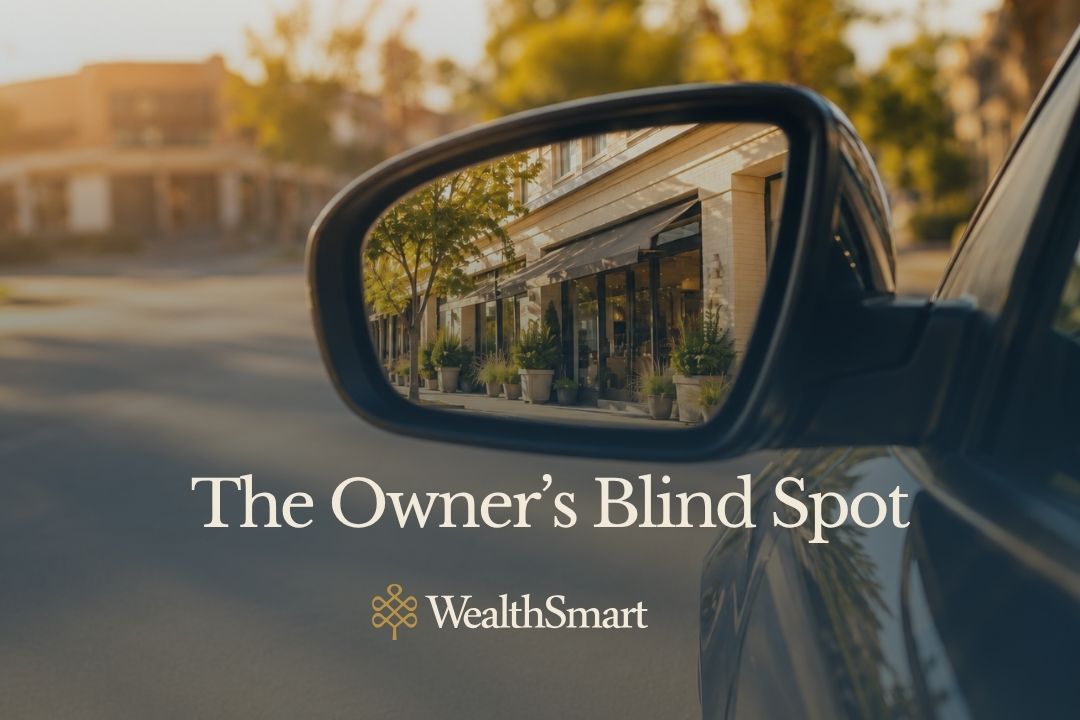 A car side mirror reflects a thriving storefront in sharp focus, while the road ahead stays blurred — representing a business owner's blind spot around retirement funding