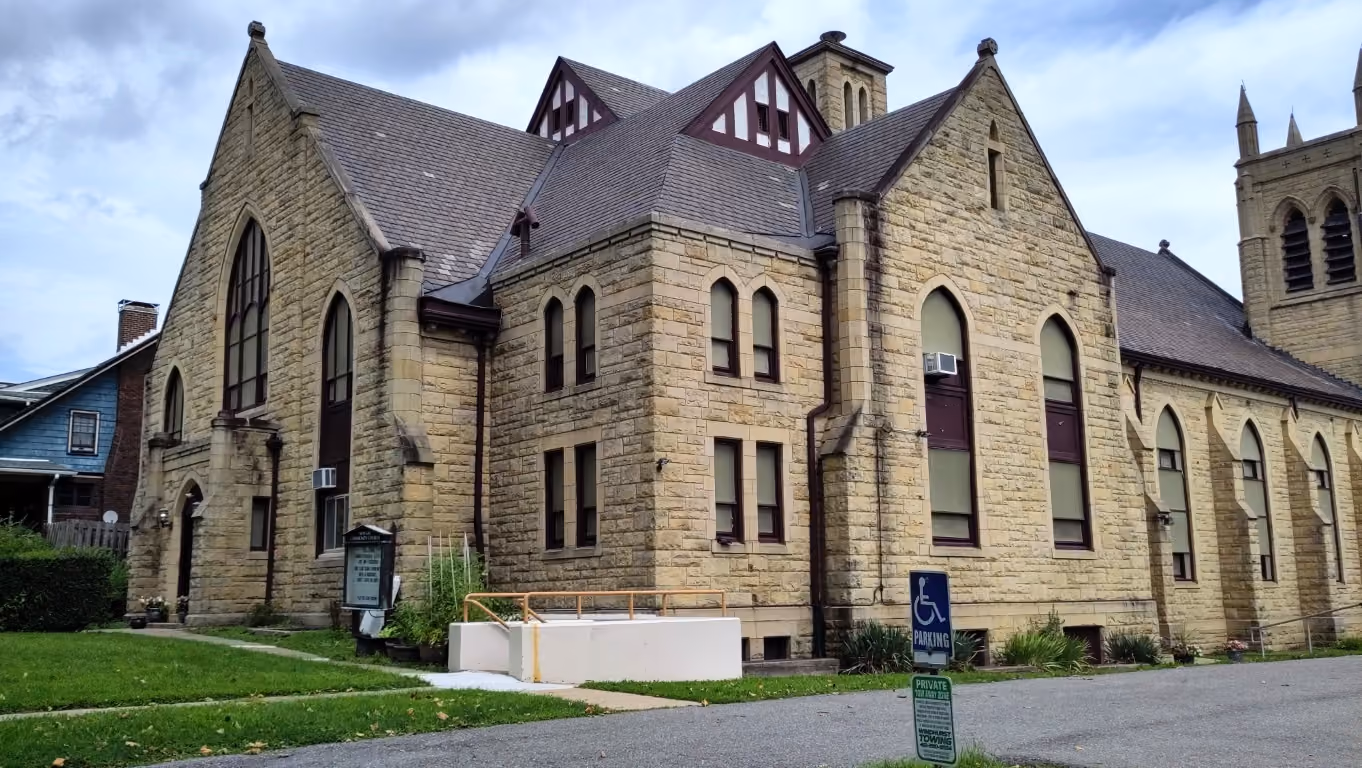 A photo of New Life Community Church from the back of the building along N. Howard Street.