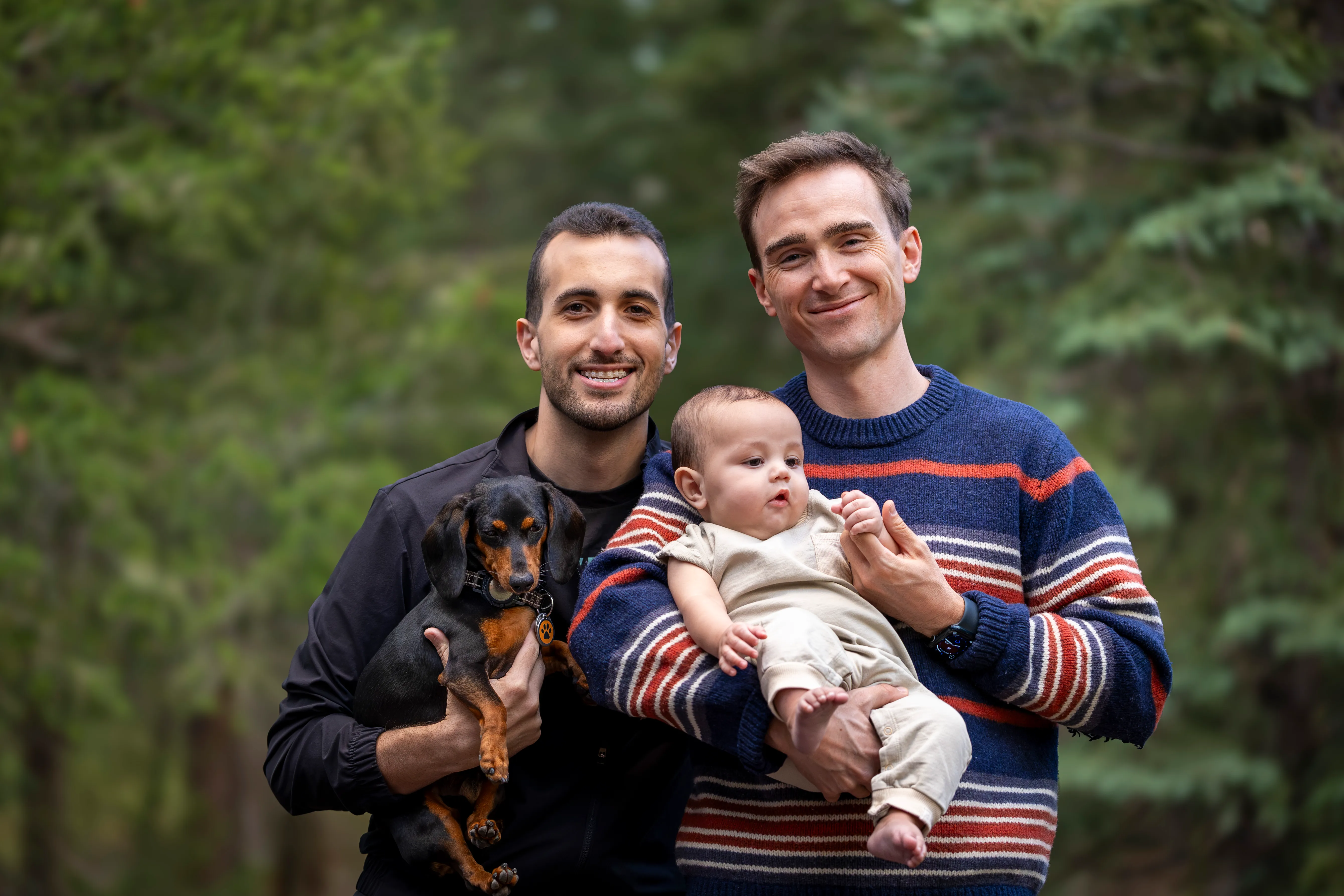 Ike with his husband McKay, their son Eli, and dachshund Buckeye.