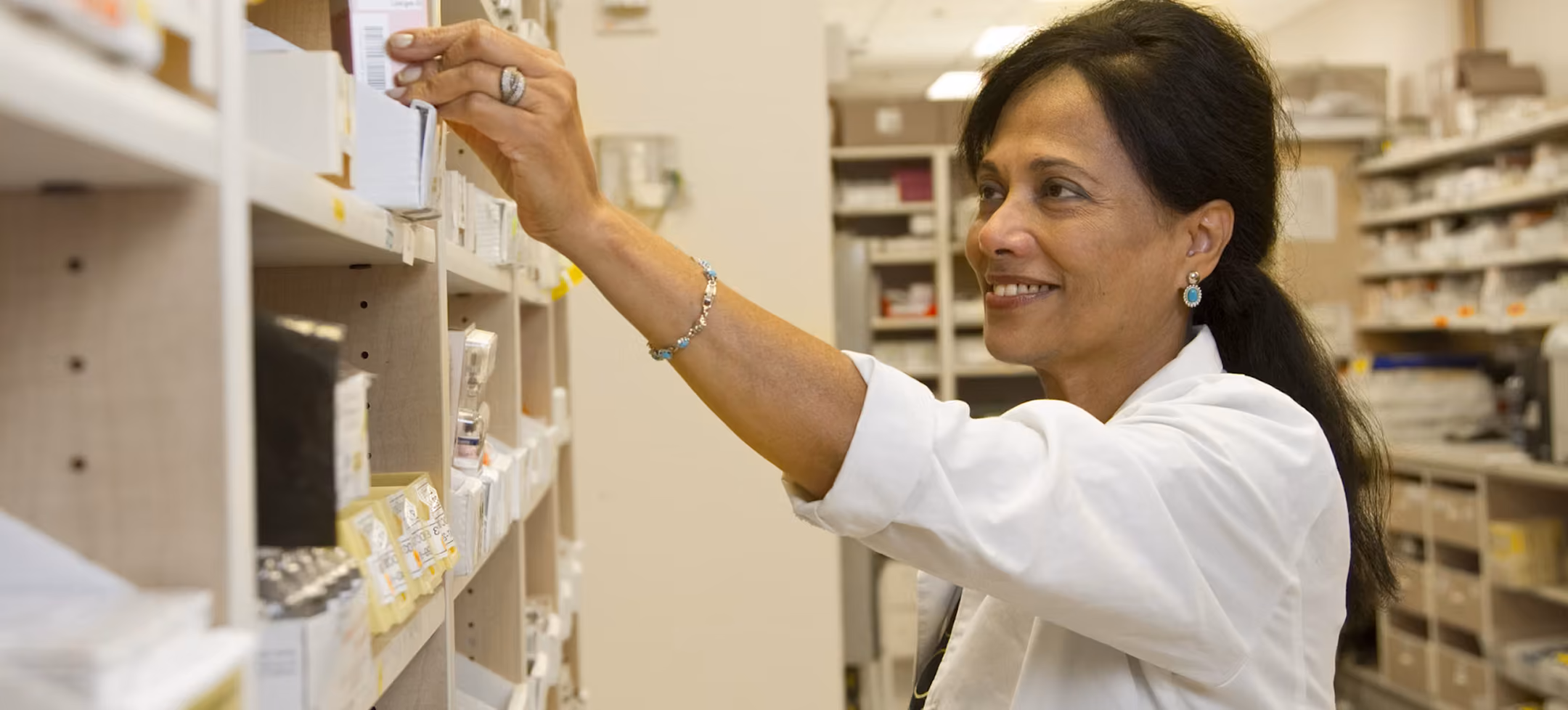 Woman at a pharmacy picking up some prescriptions