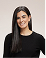 Smiling woman with long dark hair wearing a black top against a white background.