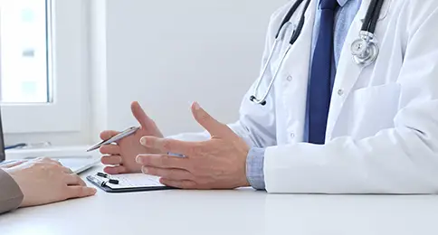 Doctor explaining how to prepare for colonoscopy during a patient consultation with the best GI doctor in Los Angeles, CA, providing clear guidance before the procedure.