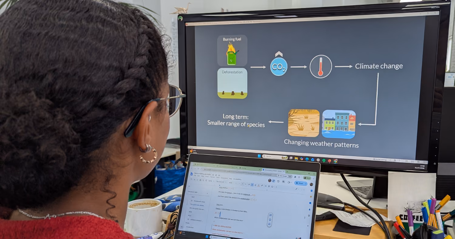A photo of a content developer working on an Up Learn video at her computer
