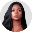 A woman with long black hair looking at the camera.