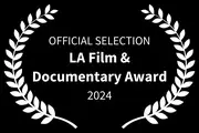 Official Selection LA Film & Documentary Award 2024 with laurel wreath design on black background.