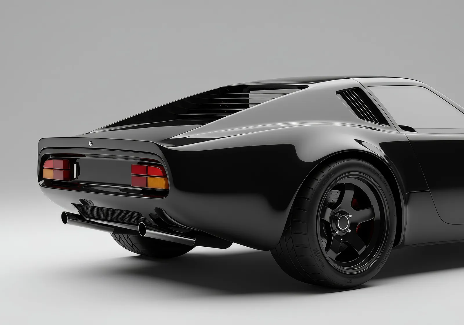 Rear side view of a sleek black vintage sports car with dual exhaust pipes and rear window louvers.