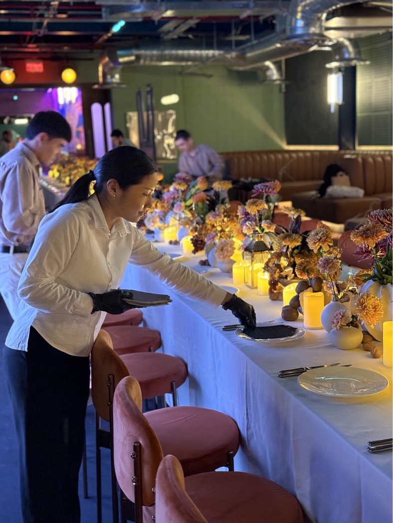 Long table set for an evening meal
