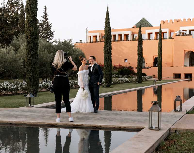 a photographer captures a bridal couple at the oberoi hotel marrakech