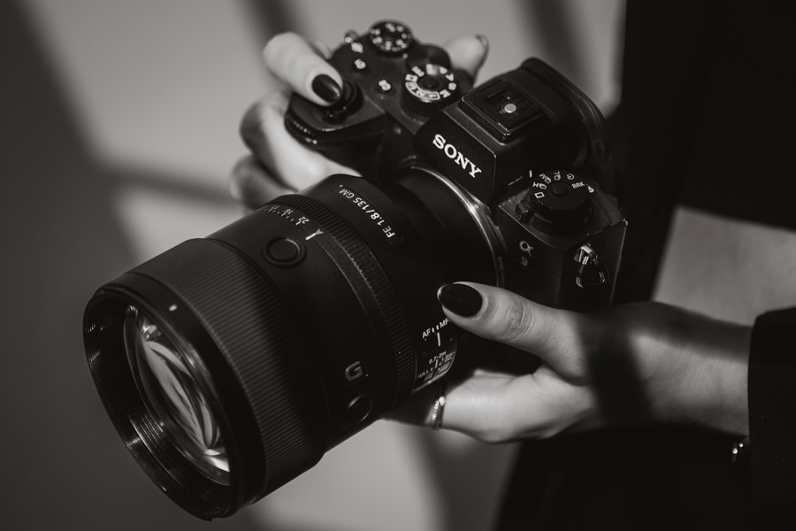 camera in the hand of a wedding photographer