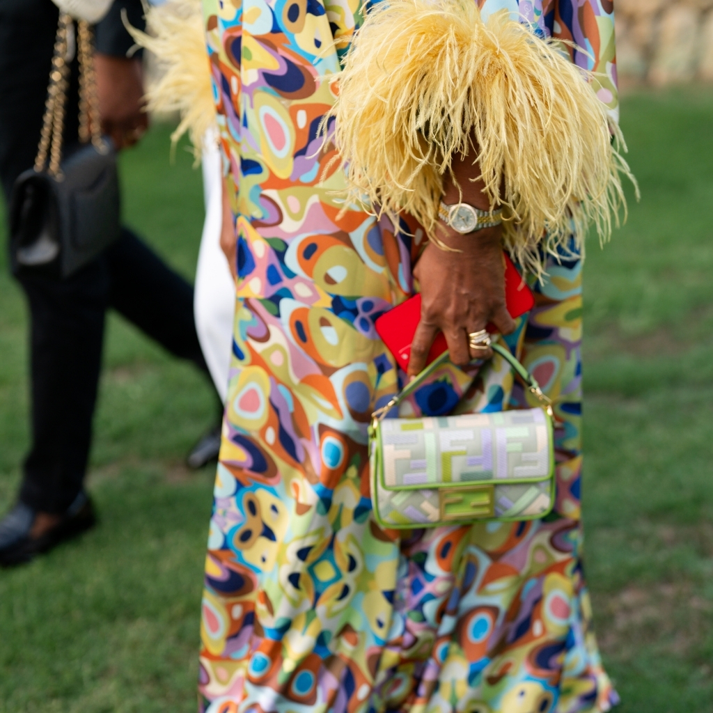 detail shot of feather dress and hand bag