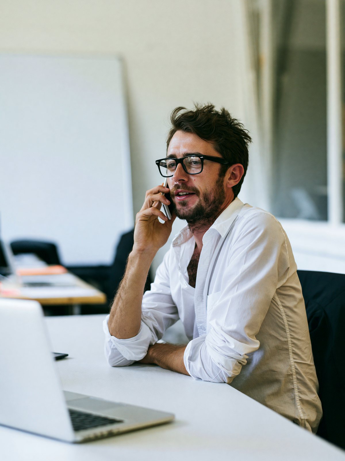 Account executive taking a call at his desk