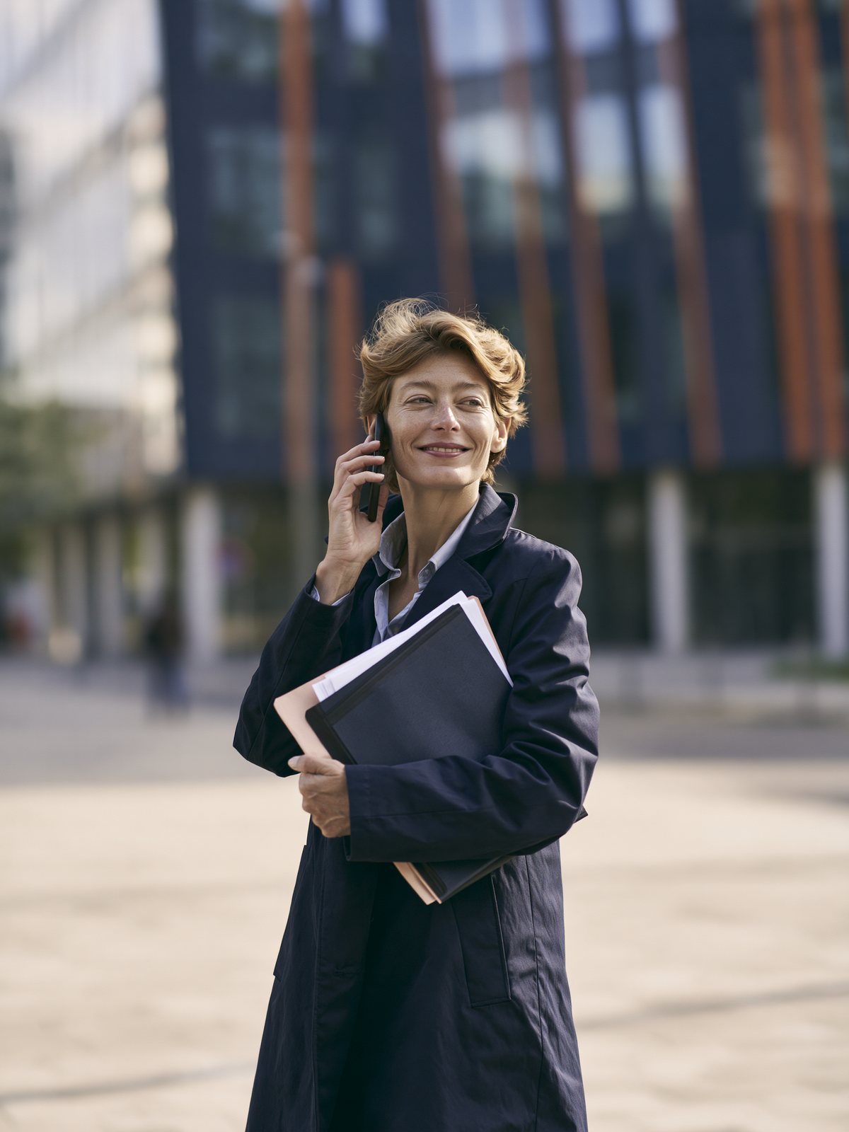 Property manager taking a call in the lobby of an office building