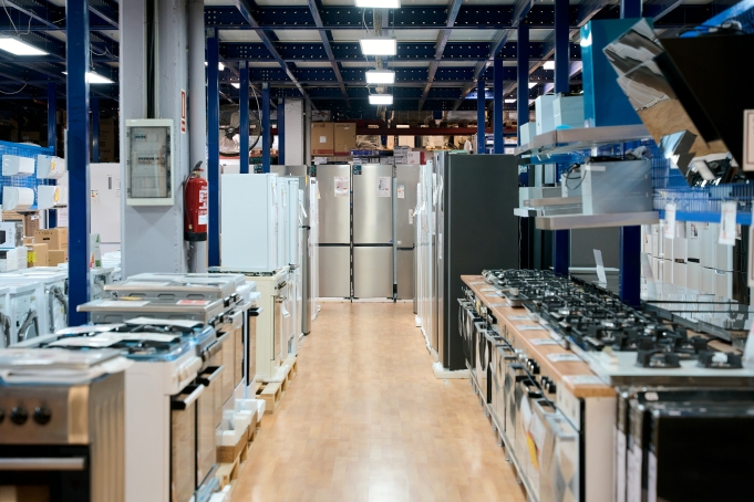 Appliance store showcasing refrigerators, ovens, and white goods
