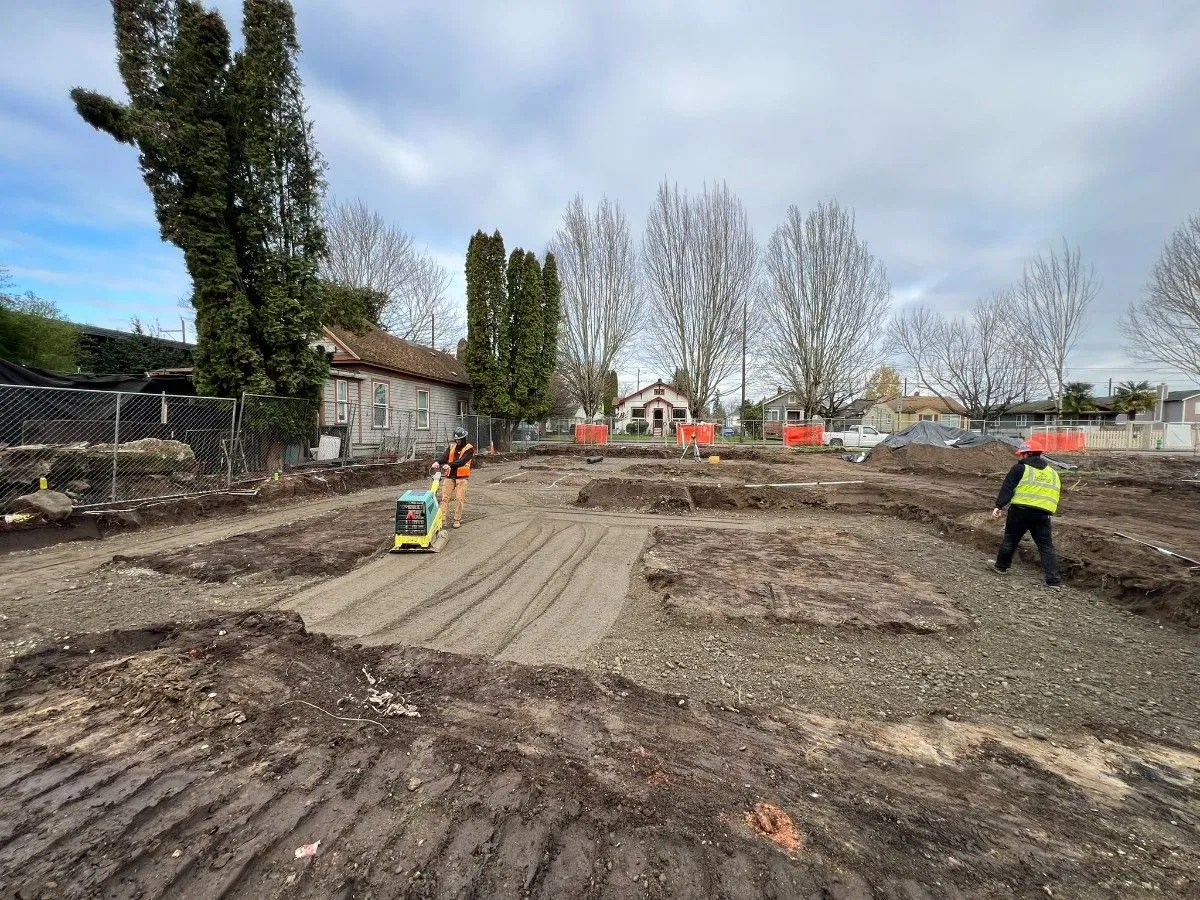 Contractors performing site preparation for utility installation