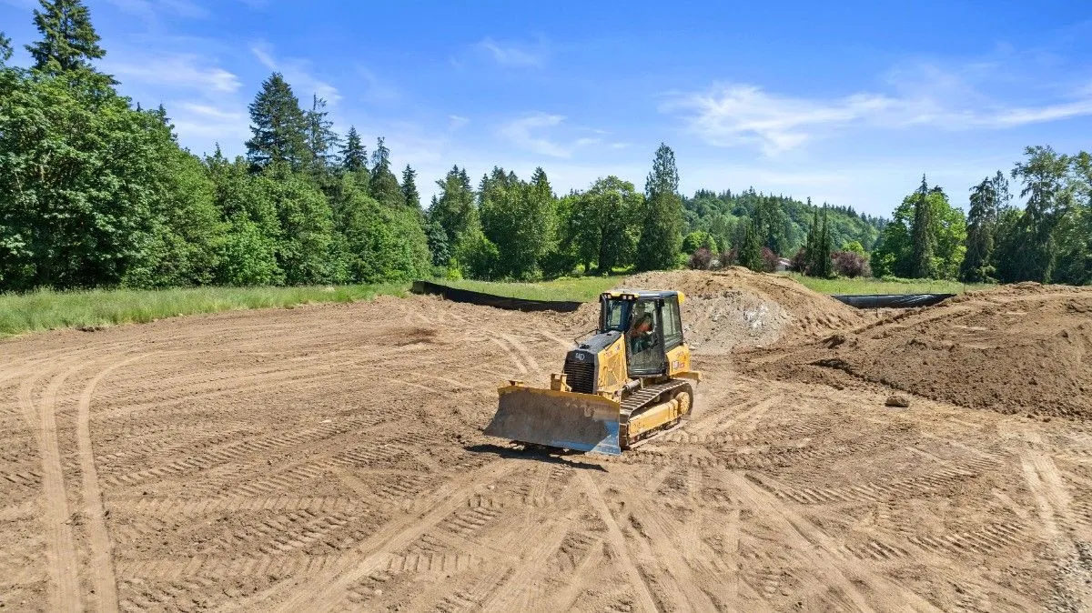 A job site cleared of grass by a bulldozer in a remote area in Seattle