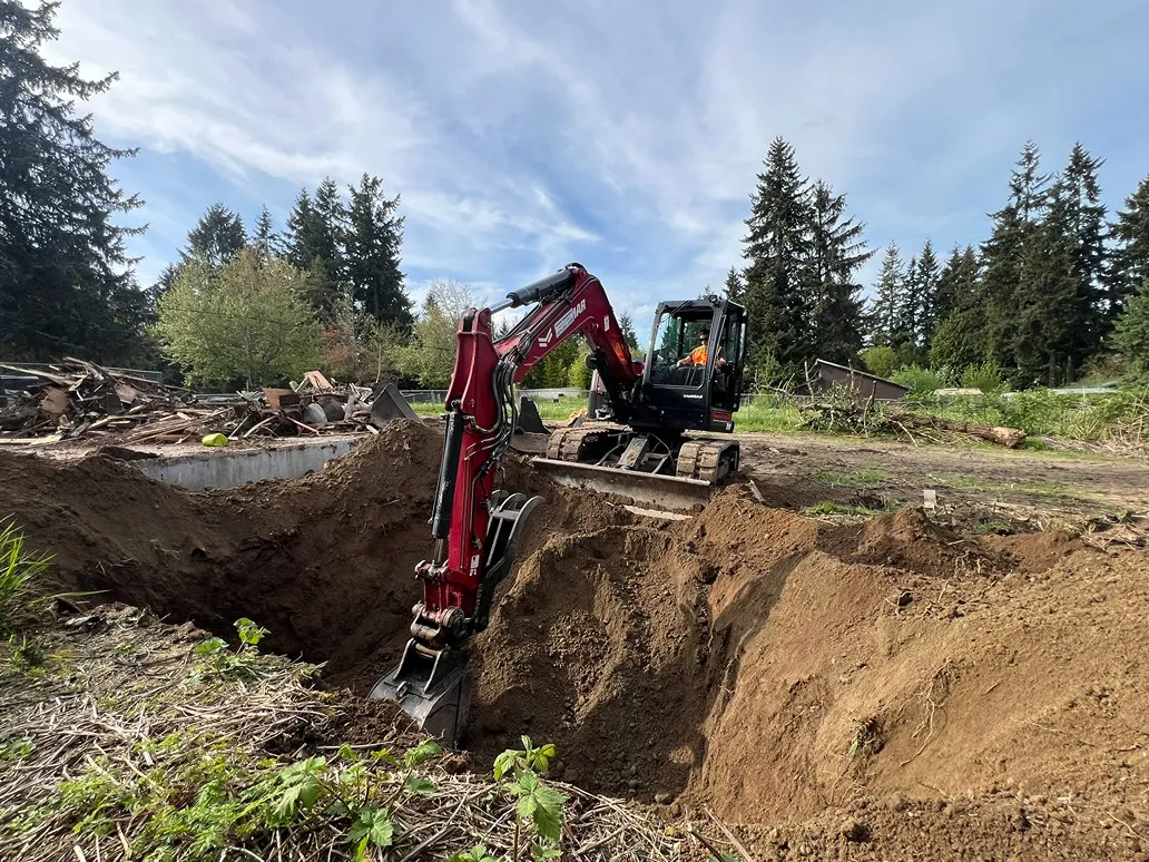 6-feet hole dug by an excavator in a newly demolished site in Seattle