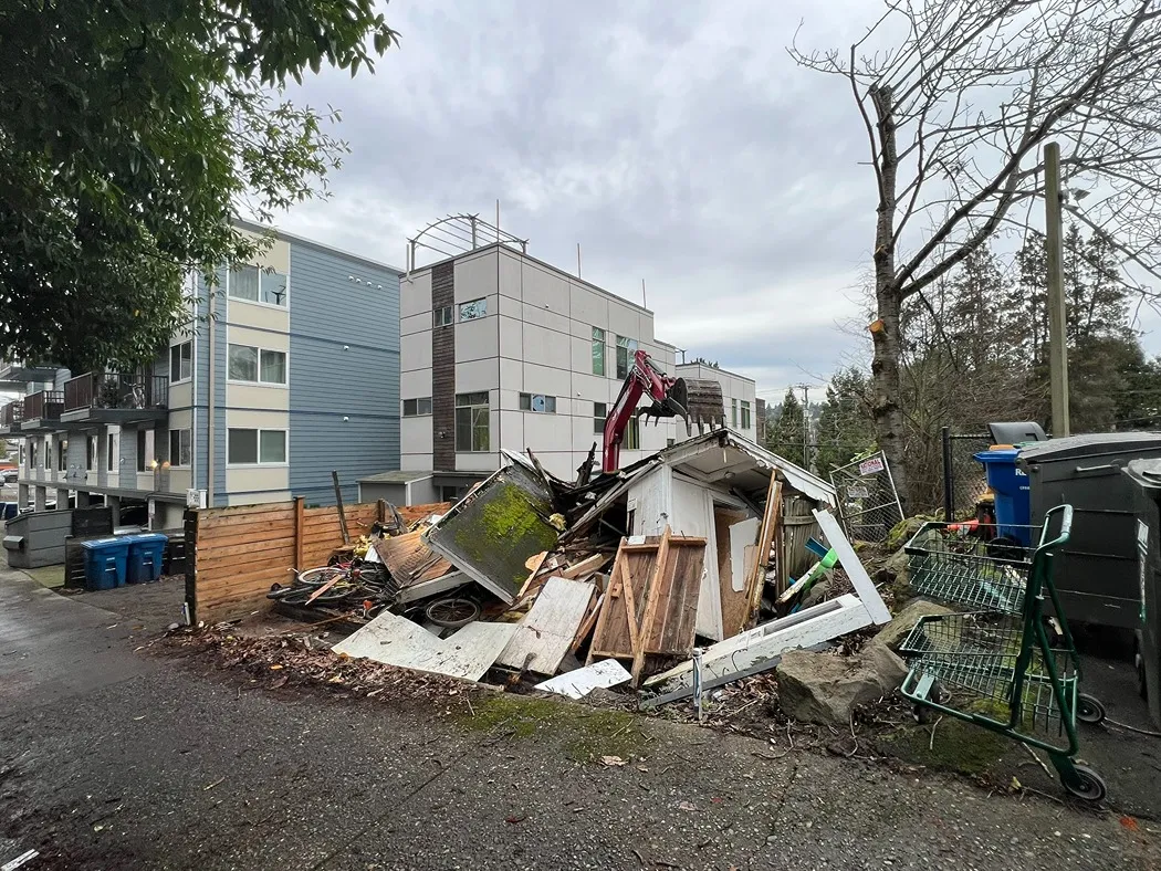 A wooden home demolished for site preparation in Seattle