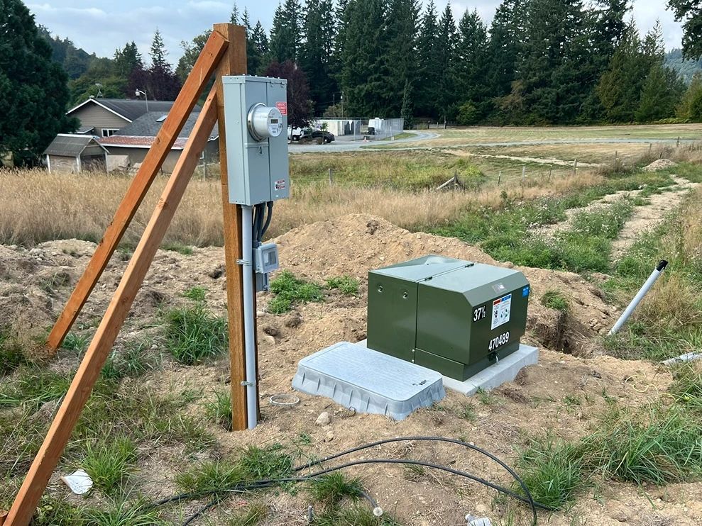 A newly installed electrical conduit next to an electricity meter in Seattle 
