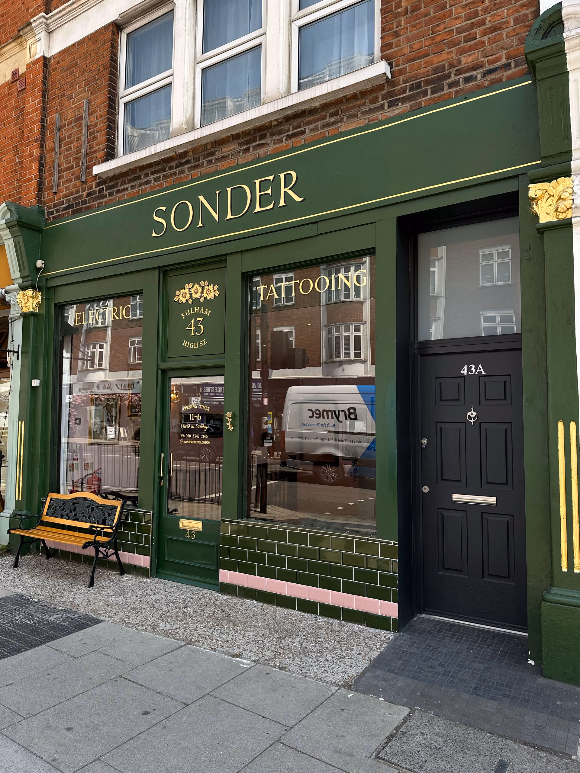 Interior of Sonder Tattoo & Piercing studio on Fulham Road, London, showing the welcoming shop environment.