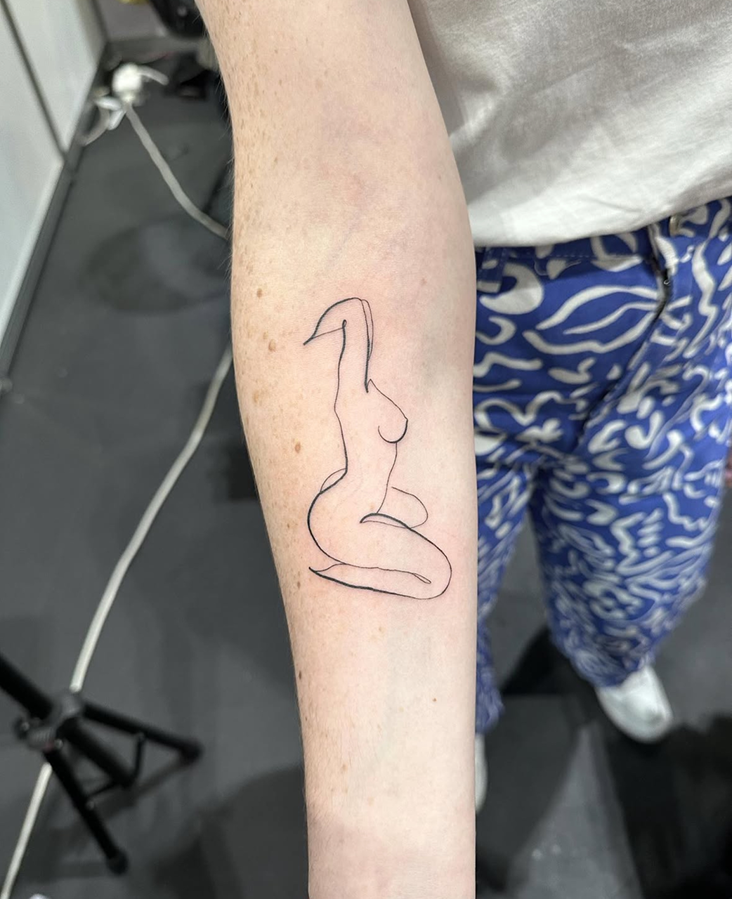 fine line tattoo of a lady