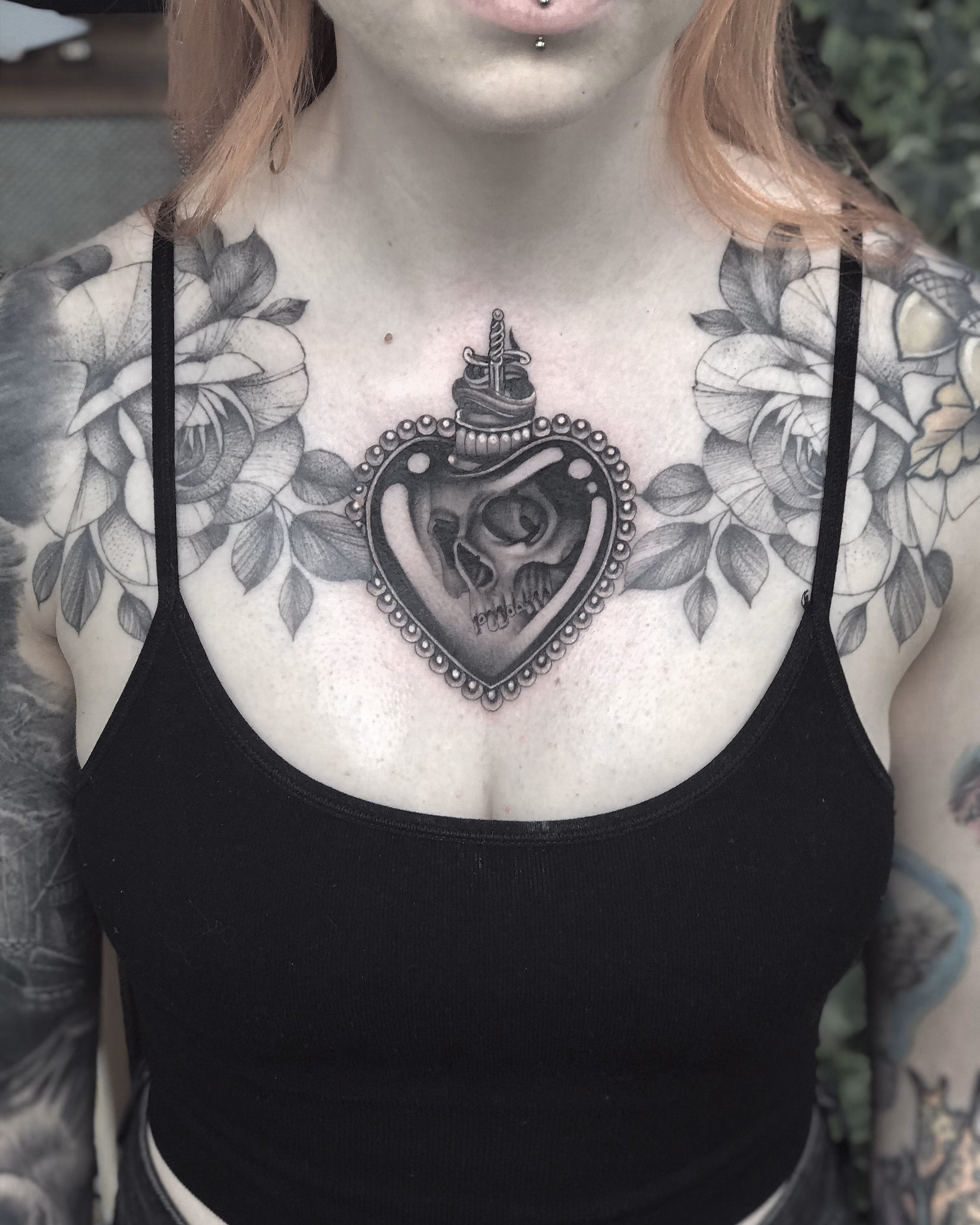 illustrative black & grey tattoo of a heart