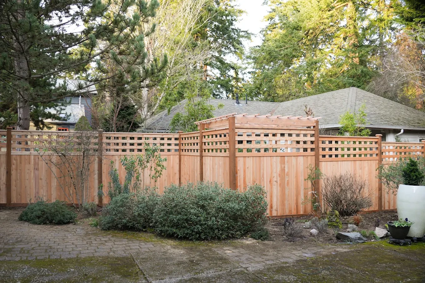 Cedar privacy fence with treated posts on a residential property