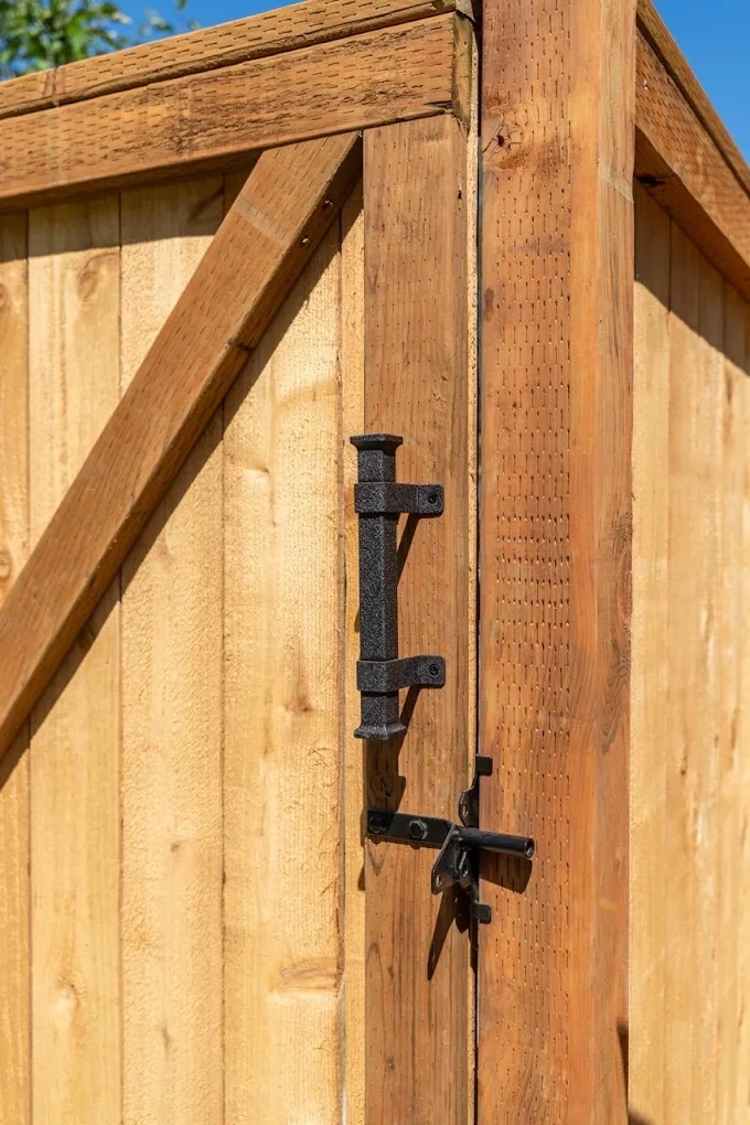 Wooden privacy fence along a residential backyard property