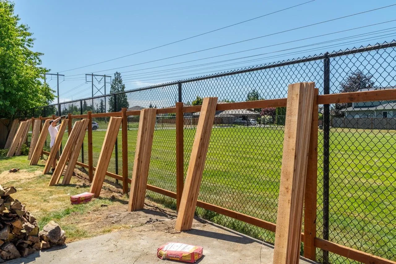 Completed fence installation walkthrough with a homeowner