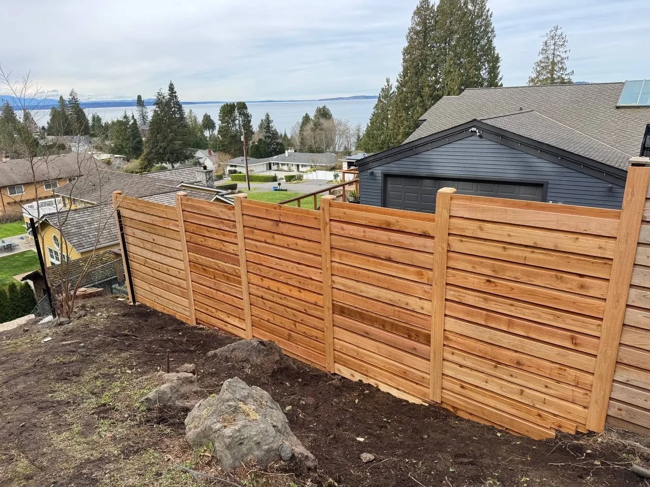Finished cedar fence and gate on a residential lot