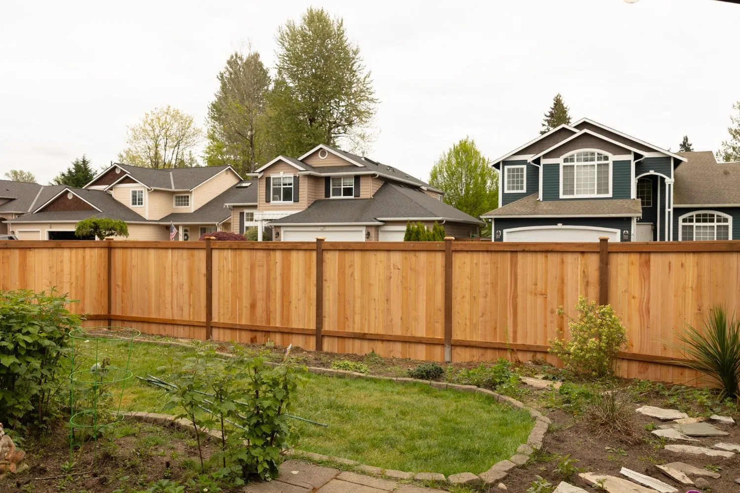 A finished wood fence installation project for frontyard privacy 