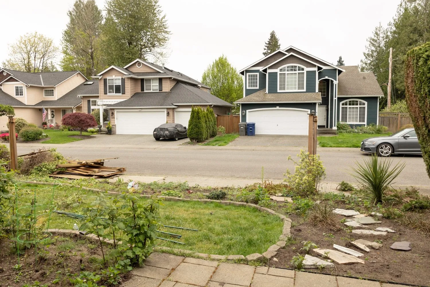 An unguarded front yard facing a road in Vancouver residential area