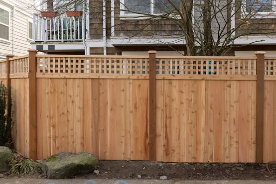 A cedar fence enclosing a pre-1980 Washington home