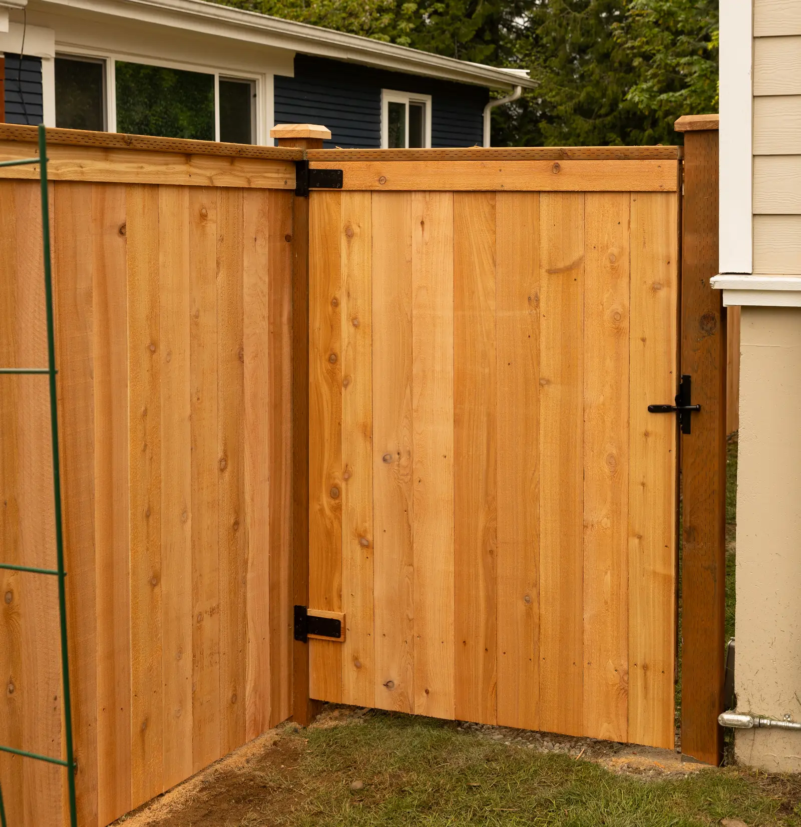 A backyard wooden gate leading to a property in Oregon City