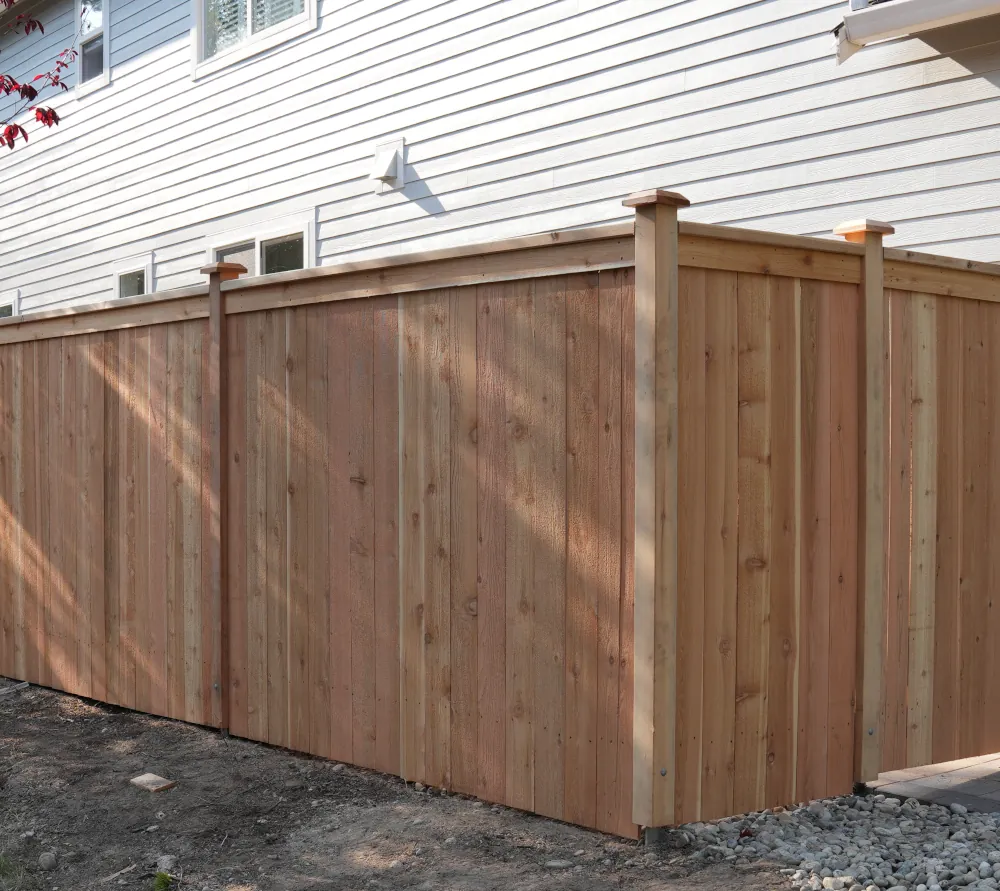 A cedar fence installed providing privacy to a two-story home in SW Washington