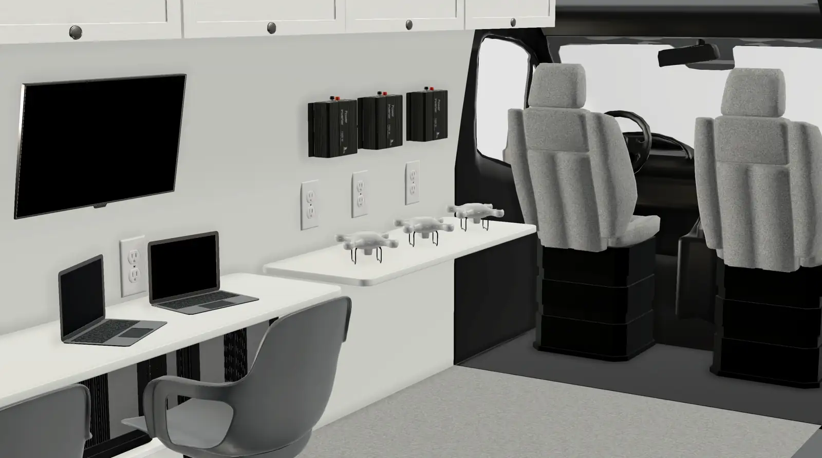 3D rendering of a van interior with white counter, two laptops, three drones, wall TV and office chair
