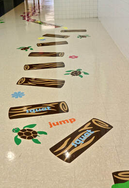 Hallway floor decals with logs turtles and movement words