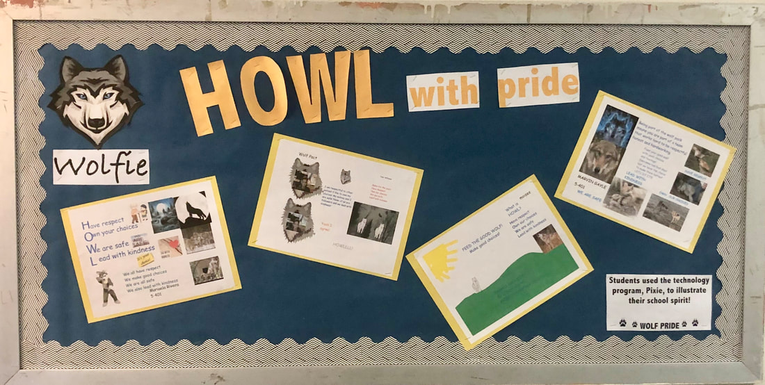 Student bulletin board displaying Howl With Pride wolf-themed school projects