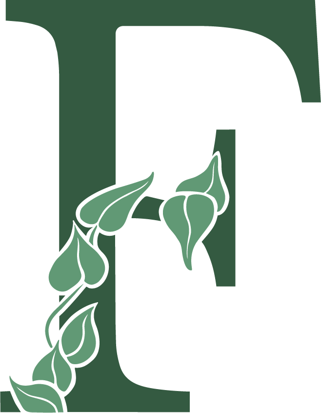 Green letter T with a trailing vine of stylized leaves wrapping around the lower left stem.