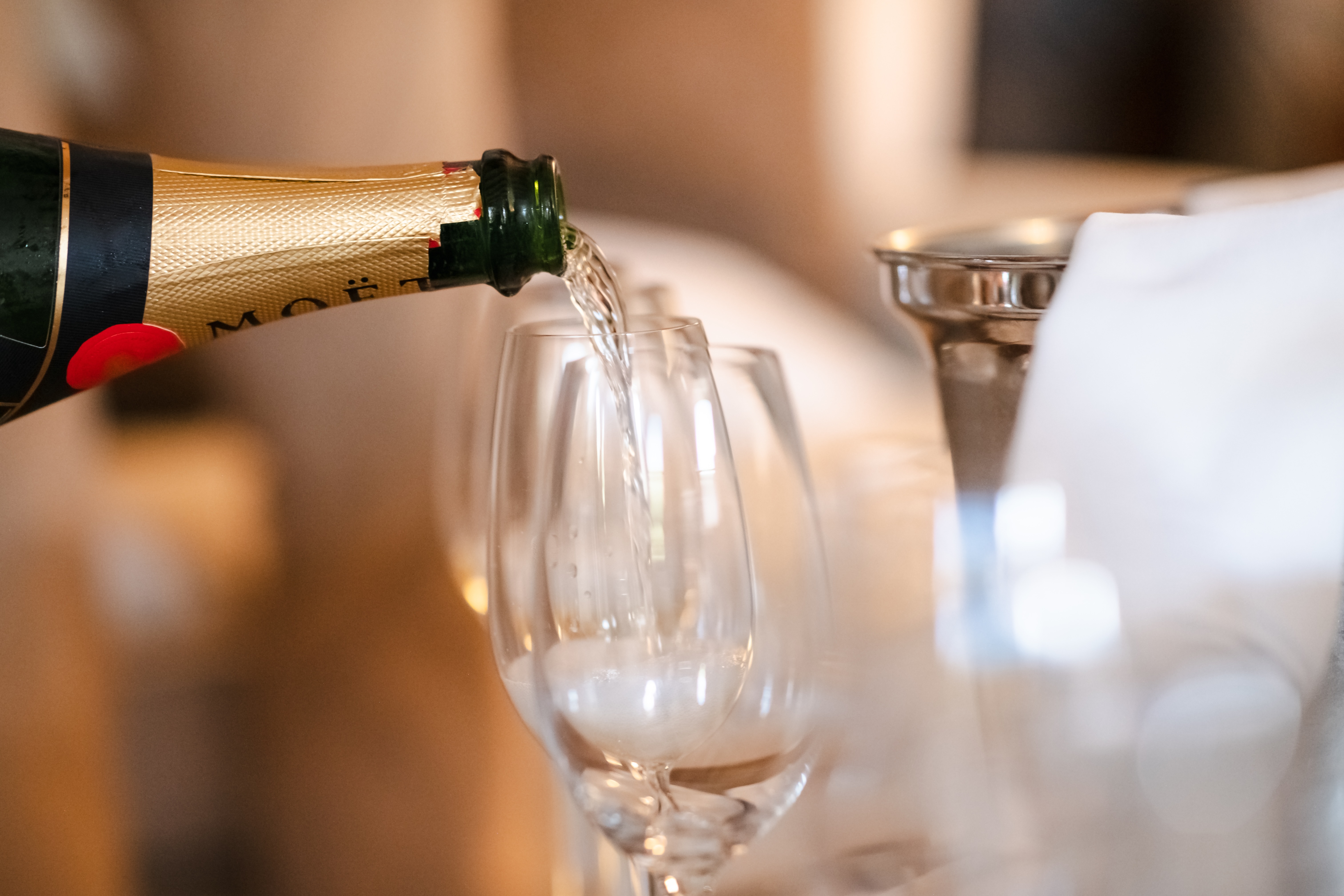 Moet Champagne Pouring Into Champagne Flute