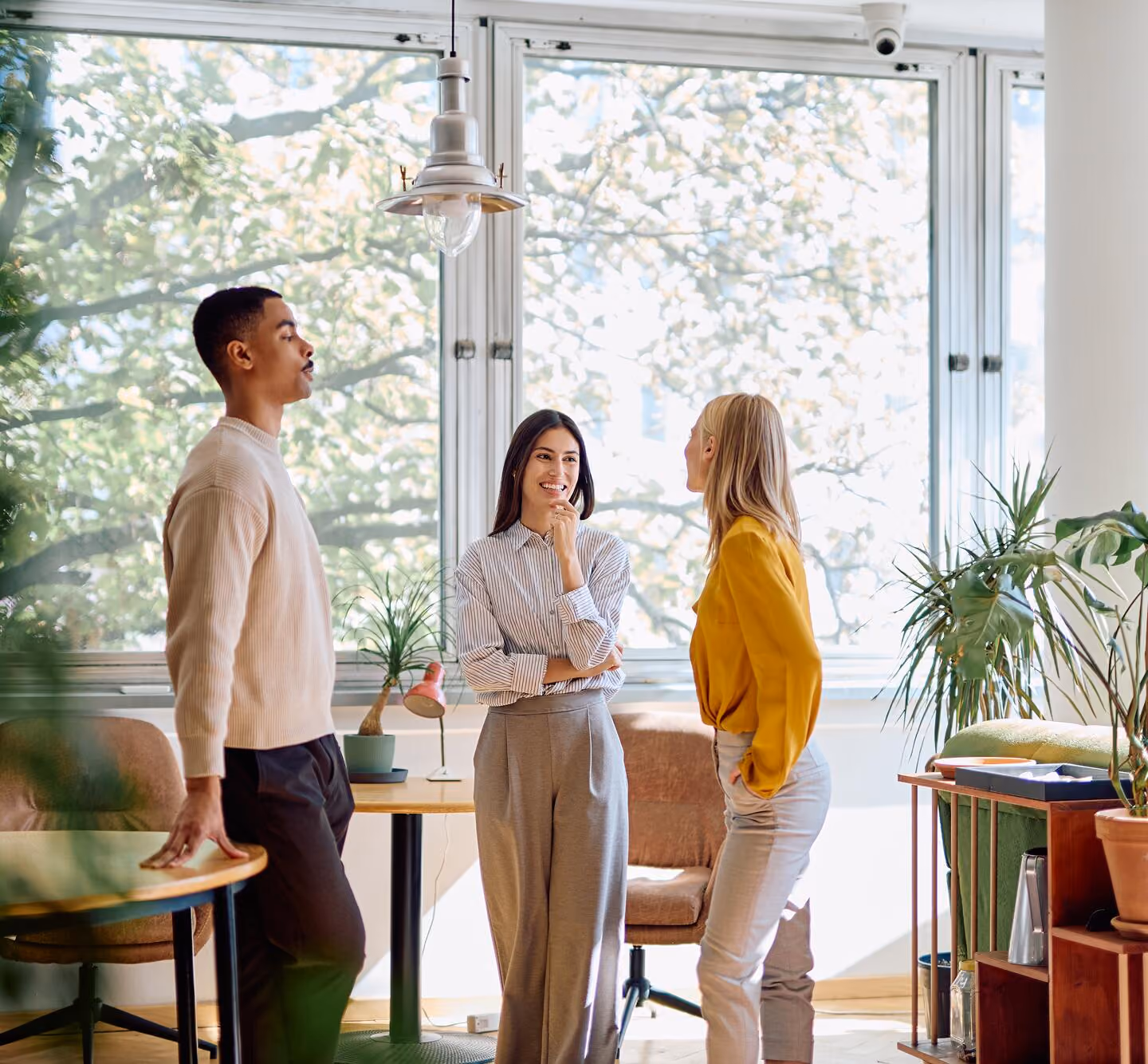 Three coworkers discussing in an office