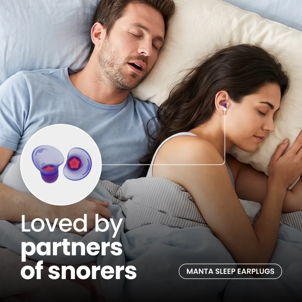 A sleeping couple, with one partner wearing Manta earplugs, under Loved by partners of snorers.