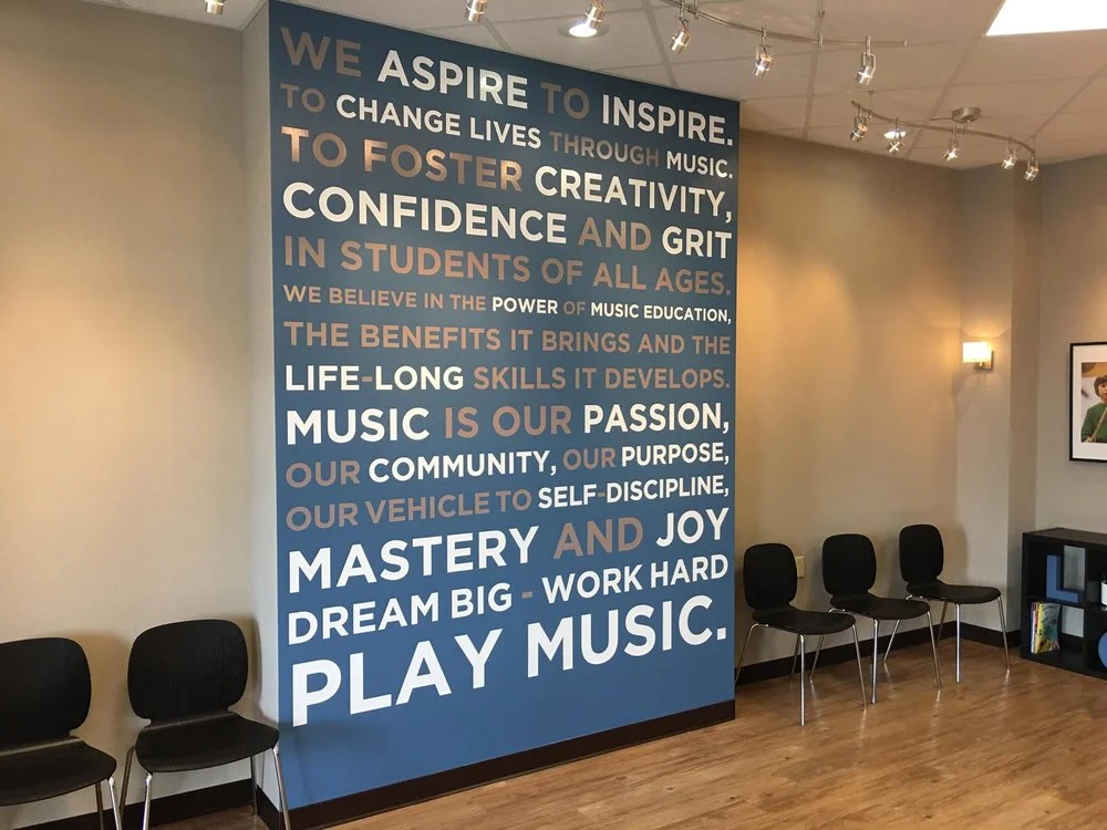 Studio lobby interior featuring an inspirational mural wall