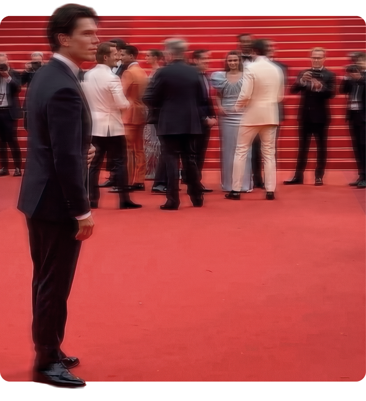 Guest in a dark tailored suit on the Cannes red carpet